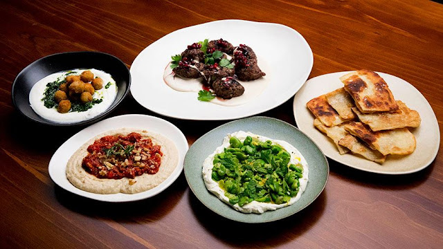 Mezze feast in serving dishes