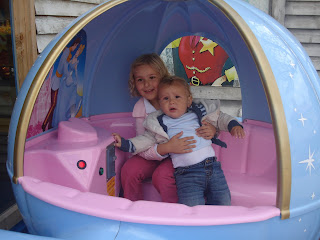 Baby Boy being held in the Cinderella carriage by Top Ender