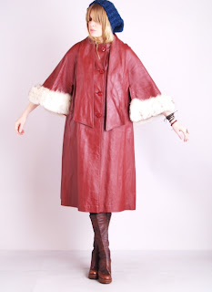 Vintage 1970's red leather coat with bracelet sleeves and white fox fur cuffs.