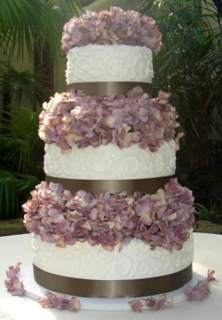 Buttercream And Hydrangeas Wedding Cake Three tier cake with brown ribbons