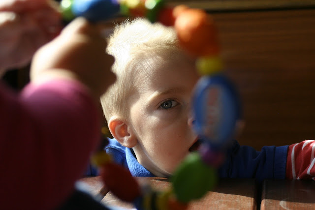 Anton through Neve's teething toy.