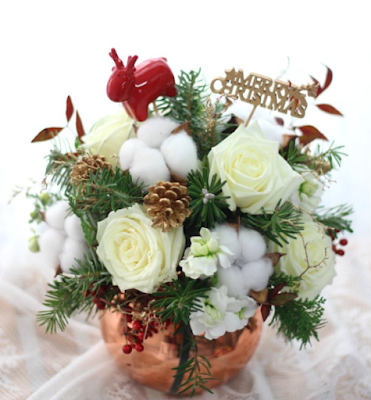 White rose arrangement for Christmas