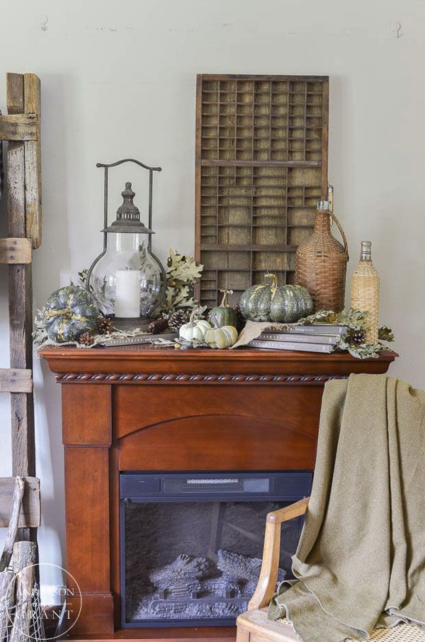 Rustic and neutral fall mantel in the living room.  ||  www.andersonandgrant.com