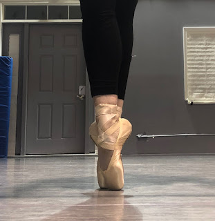 A Ballerina Beautifully Placed in her Pointe Shoes 