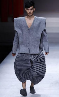 Man modeling accordion pants