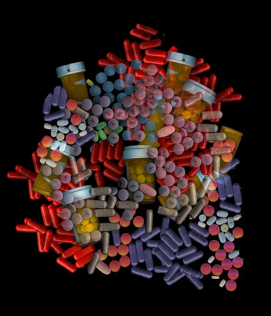 Various forms of medication including pills, tablets, and capsules symbolizing different allergy treatments.