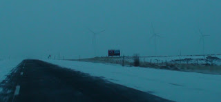 Ghost windmills appearing out of the Wyoming mist