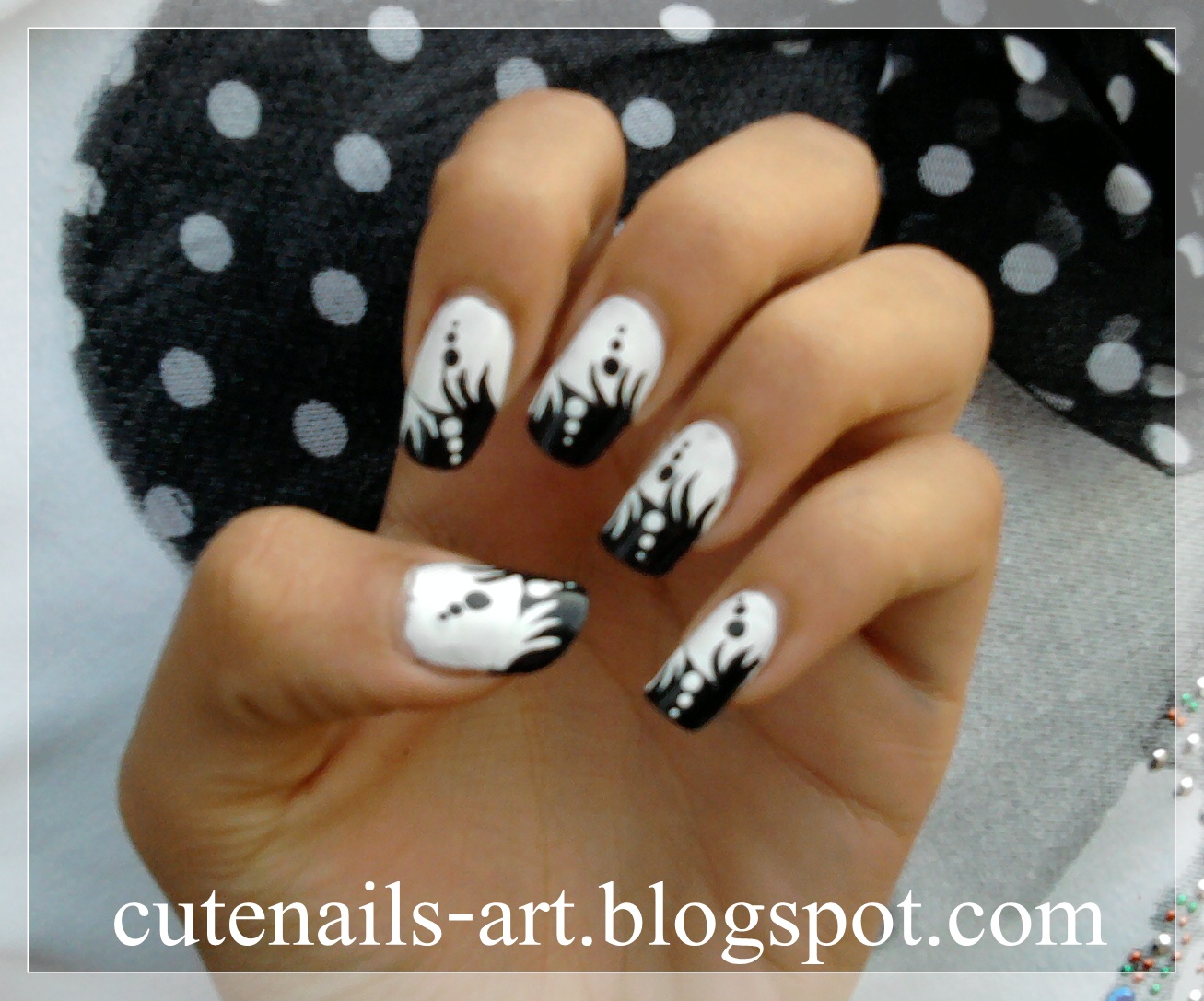 ... base coat and using white nail polish,paint half of your nails black