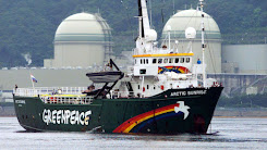 Greenpeace ship Arctic Sunrise  The photo shows the Greenpeace vessel Arctic Sunrise. It is an icebreaker used by Greenpeace to carry out environmental campaigns. In the photo, the ship is sailing in front of the nuclear power plant.