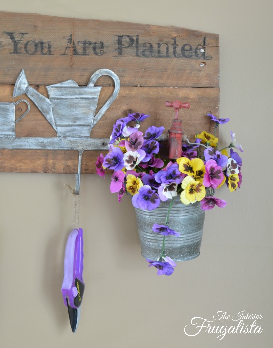 A rustic wall mount Garden Tool Holder With Flower Planter. Unique small garden tool organization for the backyard garden shed or potting bench.