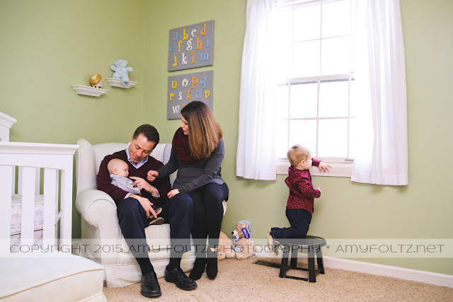 lifestyle photo of family in nursery