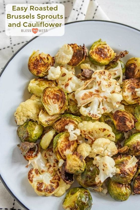 Roasted Brussels Sprouts and Cauliflower is one of our all-time favorite healthy vegetable side dishes that the whole family loves to eat.  #brusselssprouts #cauliflower #healthy