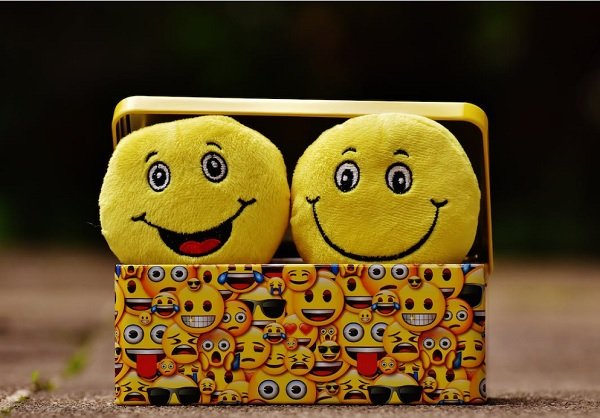 Two emojis representing two emotions used for sales