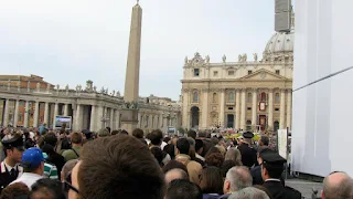 Sea of people walking towards St. Peter's in Vatican City Italy