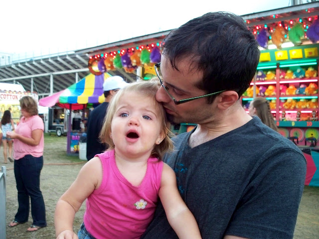 Daddy and one year old near the game booths