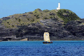 sabani sailing by lighthouse