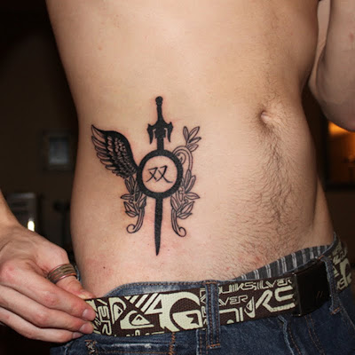 Sword tattoo on abdomen