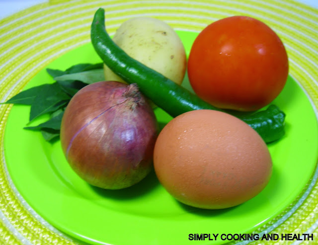 Curry leaves, potato, tomato, egg, onion and green chili