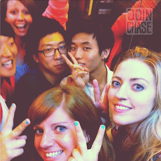 Foreigners and Koreans posing in an elevator in Ulsan, South Korea.