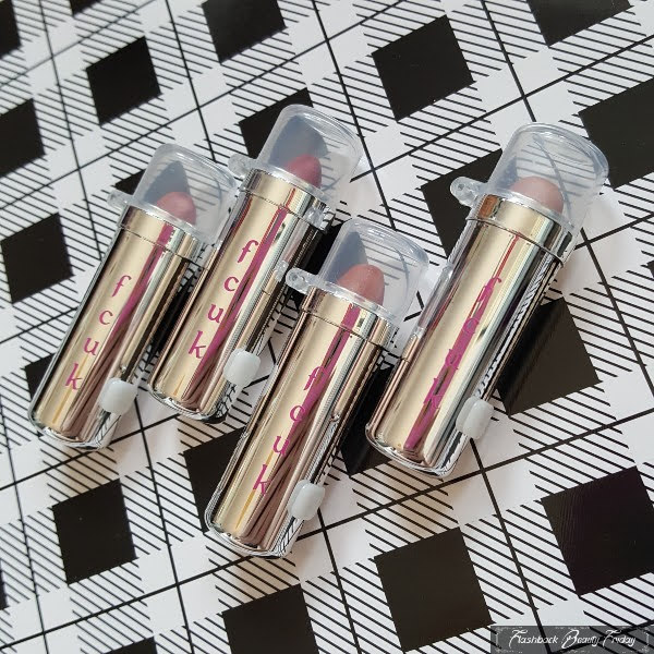 silver chrome lipsticks cases with pink FCUK branding and see through lids