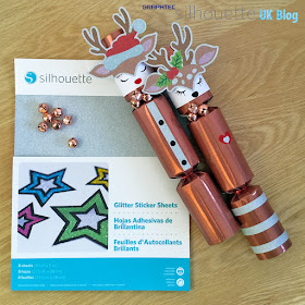 Custom Christmas Crackers designed by Janet Packer (CraftingQuine) for the Silhouette UK Blog using Silhouette Adhesive Glitter Sticker Sheets.