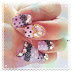 Purple bling bling heart nails.