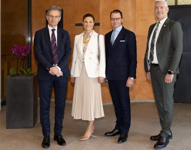 Crown Princess Victoria wore a new London white cross blazer by The Extreme Collection. VESNA W Meghan gold-beige silk blouse