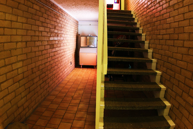 A staircase surrounded by brick at a motel in Branson, Missouri.