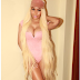 Nicki Minaj wows in pink body suit and knee long blonde hair