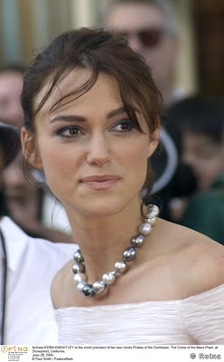 Actress KEIRA KNIGHTLEY wearing black and white pearsl at the world premiere of her new movie Pirates of the Caribbean: The Curse of the Black Pearl