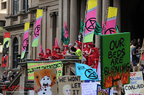 Sydney Climate Rally - Red costumed Extinction Rebellion performance during speech.