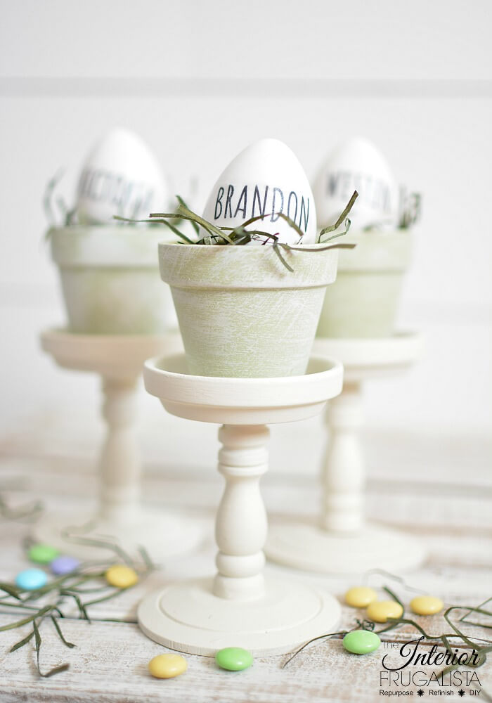 Gorgeous budget-friendly Rae Dunn inspired Easter egg place card holders with French Country style with repurposed dollar store mini terracotta pots.