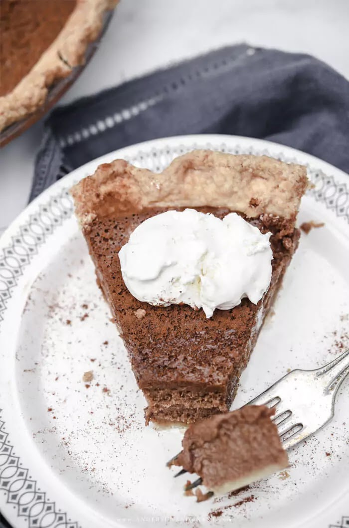 Slice of Apple Butter Pie topped with whipped cream