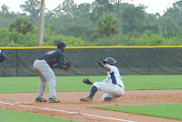 Edward Dorville slides into third with an RBI triple.  Photo by Jim Donten.