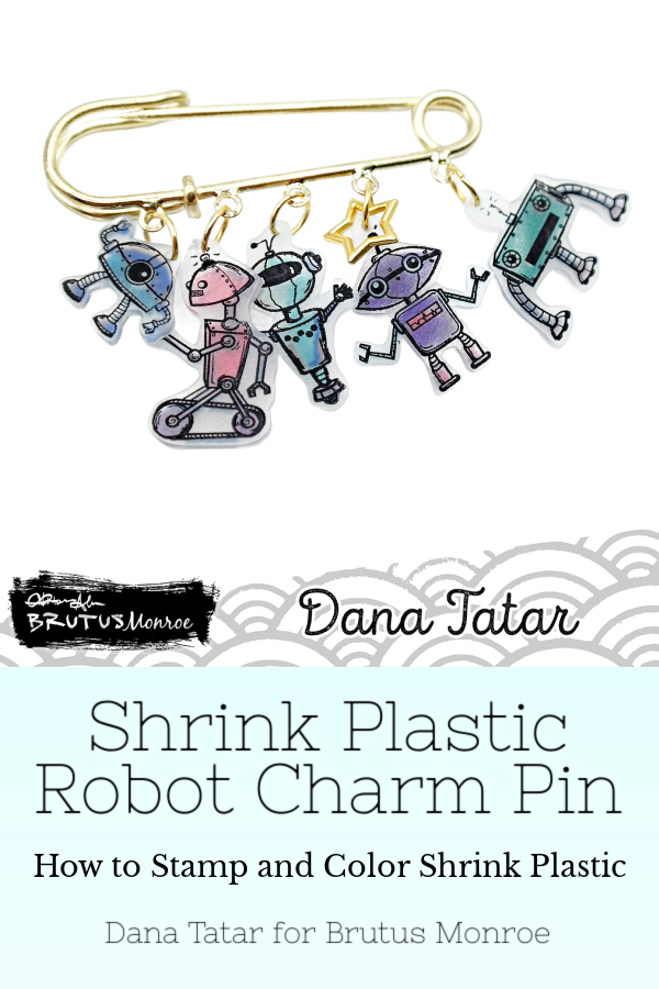 Dana Tatar creates a whimsical charm pin using the Best Bots Stamp Set, which features robots from outer space, and shrink plastic for Brutus Monroe.