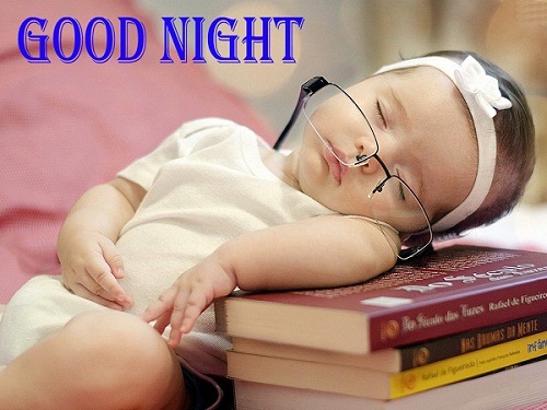 Cute Baby Sleeping on Books and Wishing Good Night