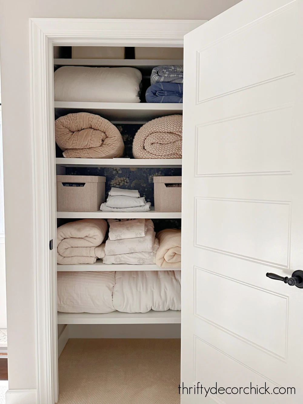 DIY wood shelves in linen closet