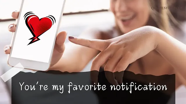 A phone screen showing a heart emoji pop-up.