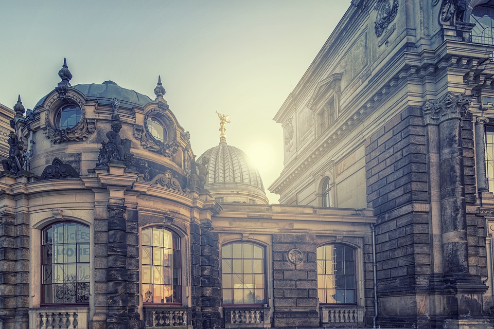 Sunset behind an old and beautiful building