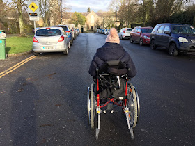 ME Advocate Ireland (MEAI) member in wheelchair on the road