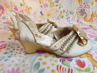 Faux gold leather trim and on heel in rapunzel wedding shoes of limited edition costume shop disney 2012