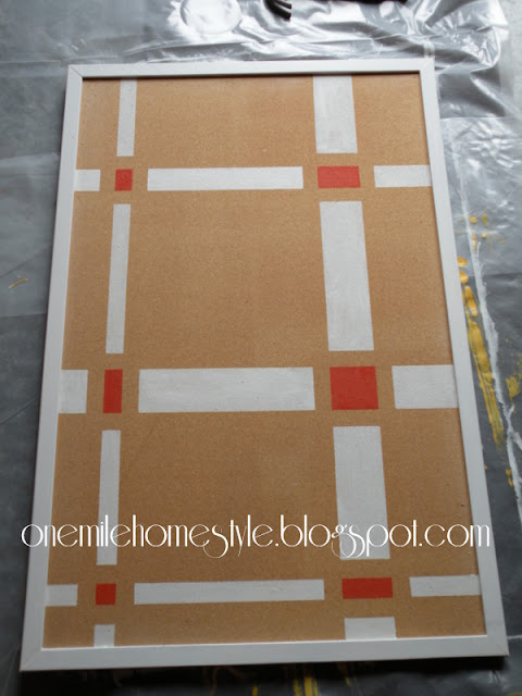 Bulletin board with abstract white and orange design