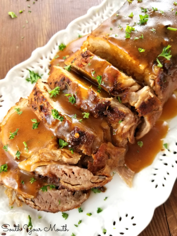Butter-Braised Slow Cooker Pork Roast with Pan Gravy! A fork-tender pork loin drenched in sizzling butter seasoned with Cajun spices cooked to perfection in the crock pot plus a simple pan gravy.