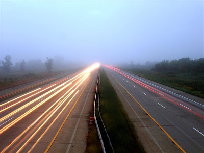 early morning highway car tail lights