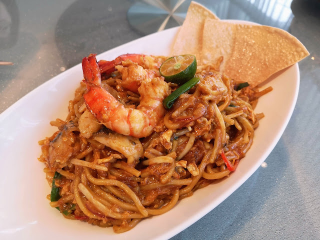 Seafood Paradise Mee Goreng with Ms. Maria & Mr. Singh's Masala served with Papadum