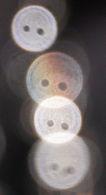 column of orbs with holes