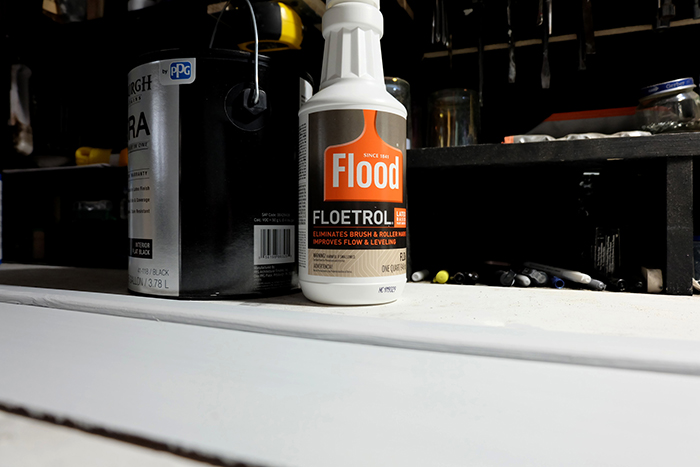 bottle of Floetrol and can of black paint