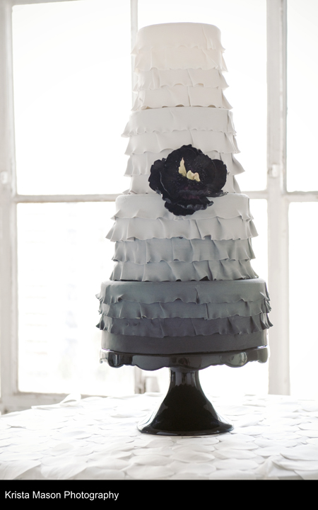  we have a black and white gradient ombre effect ruffle wedding cake