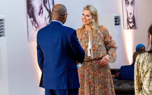 Queen Maxima wore a samera multi-coloured floral top and samera pleated skirt by Alexis