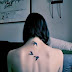 Whitish Lady Women Full Back With Single Bird Tattoo